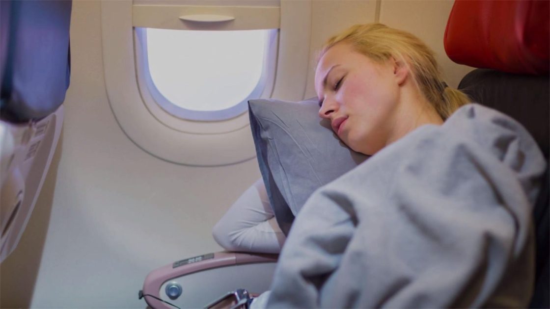 best way to sleep on a plane